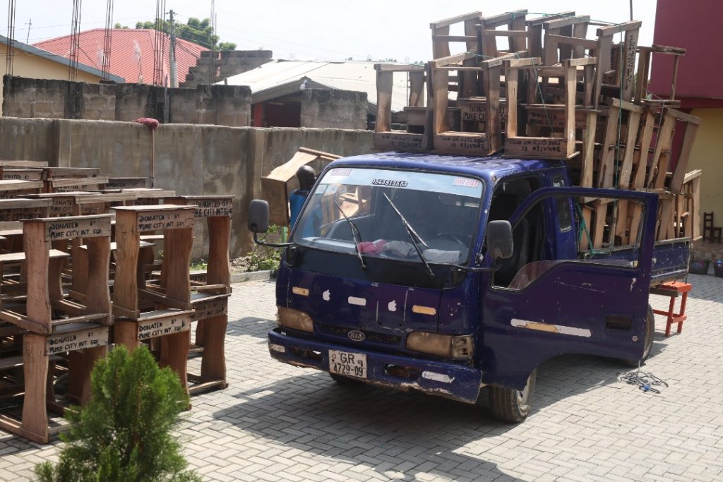 desks being loaded at PCIS for donation to Nsakina Basic School