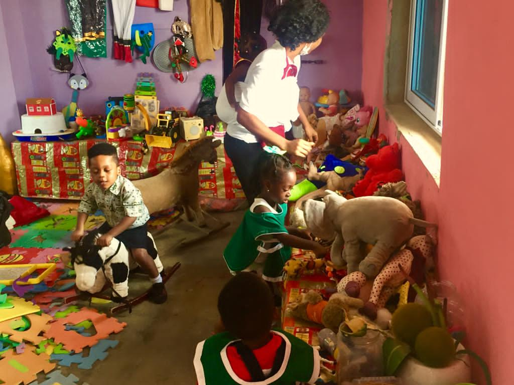 A Caregiver with her pupils in class